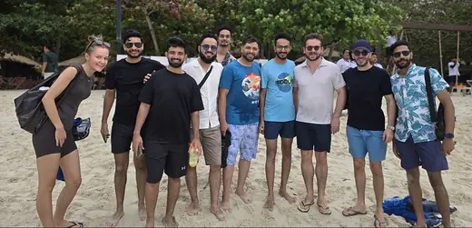 Part of the team on a beach in Phuket on the 2025 trip.